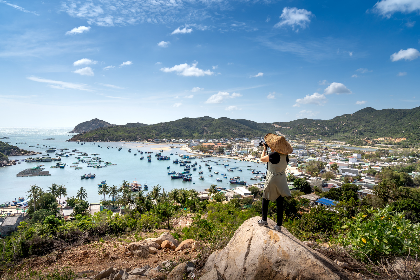 Woman Photographing Vinh Hy Bay in Vietnam From a Hill